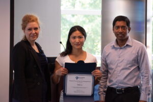 Rizzie Lu received a certificate from Dr. Karmansachi in REU Grant 2024-2025